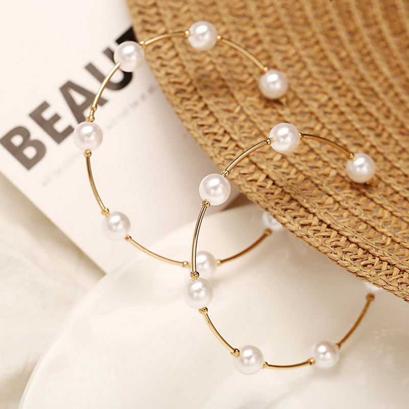 Pearls wrapped around ear rings , Hina khan style
