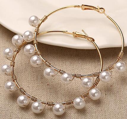 Pearls wrapped around ear rings , Hina khan style
