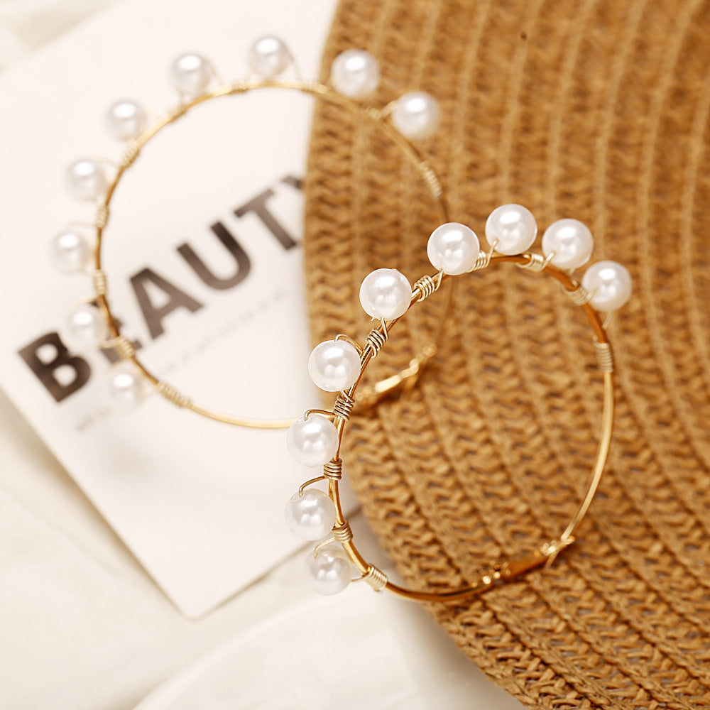Pearls wrapped around ear rings , Hina khan style